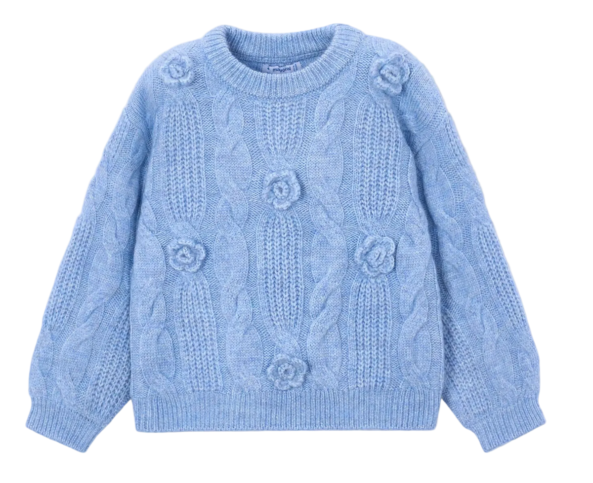 A light blue cable-knit sweater with raised floral details, laid flat on a light gray background.