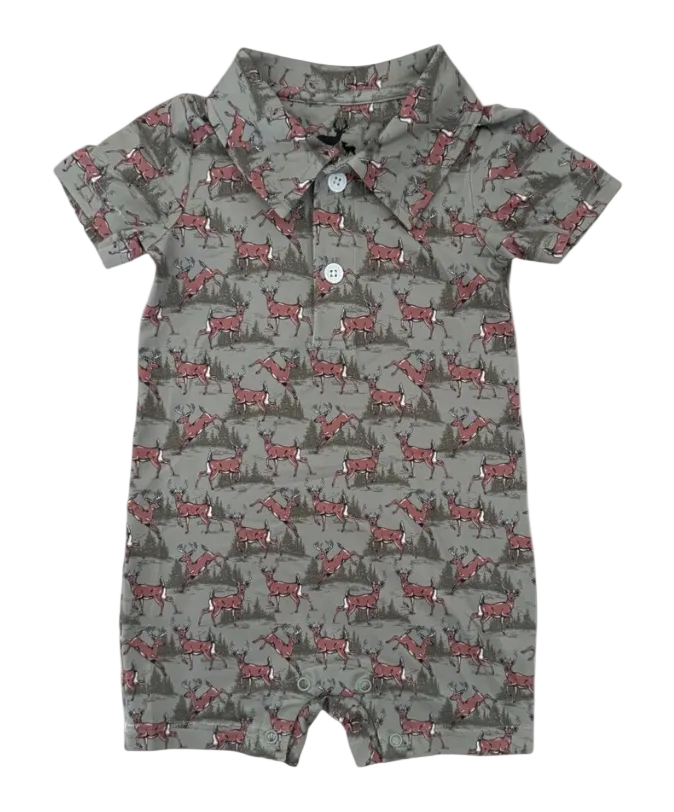 A baby short-sleeve romper in a gray-green base color with an all-over print of whitetail deer and dark pine trees. It features a camp collar and a two-button placket.