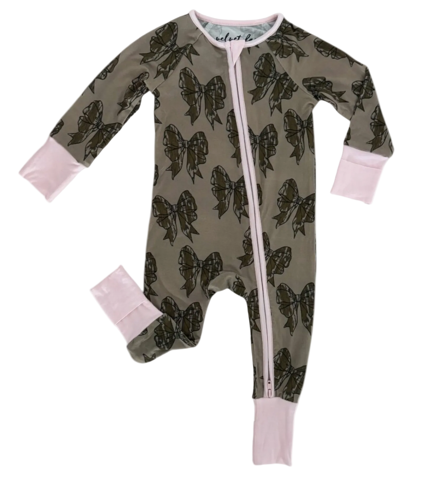 A baby long-sleeve footed sleeper in olive green with a dark brown bow pattern, featuring light pink cuffs and a pink zipper.