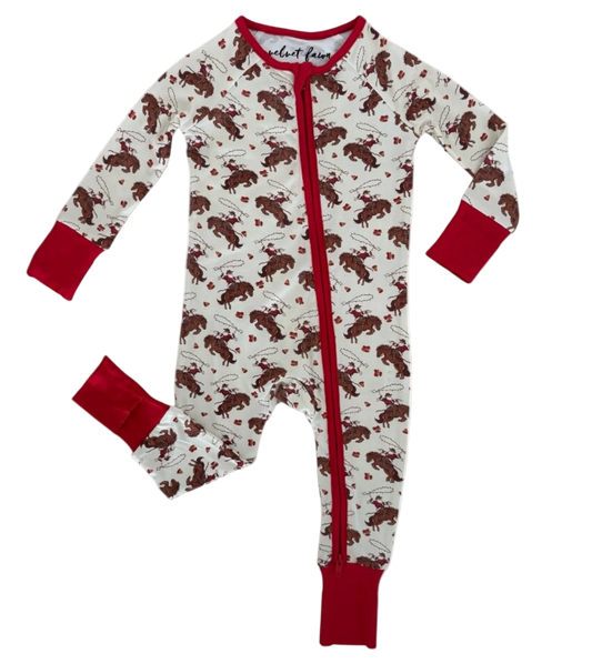 A baby long-sleeve footed sleeper with a red zipper, featuring an all-over print of santa ridning reighdeers  on a white background with red cuffs and collar.