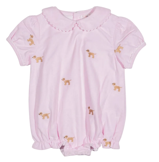 A light pink short-sleeve baby romper with a Peter Pan collar, featuring embroidered dog scattered across the front.
