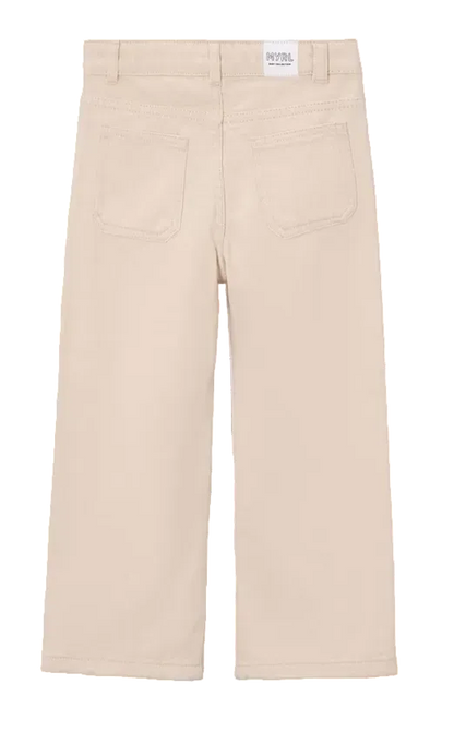 Back view of a pair of beige wide-leg pants for kids, featuring two back patch pockets and a white brand label at the waistband.