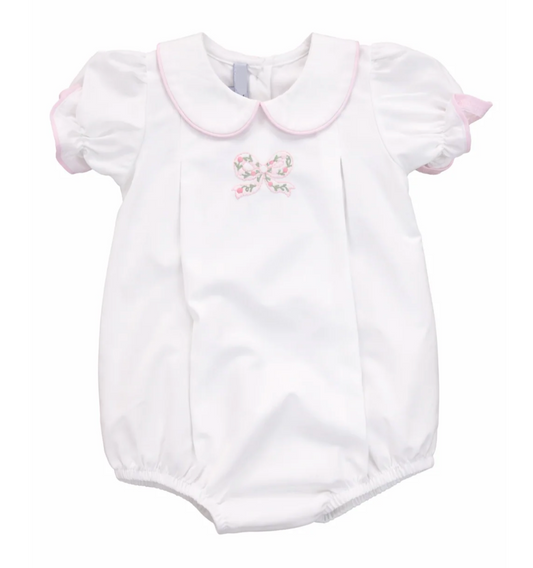 White girls bubble with pink piping around peter pan collar and applique embroidered bow on the front