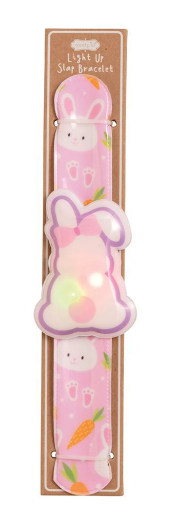 The mudpie Mud Pie Easter LED Slapbands feature a pink bunny and carrot design with a central bunny-shaped light, packaged on cardboard—ideal as kids party favors or a fun light-up bracelet.