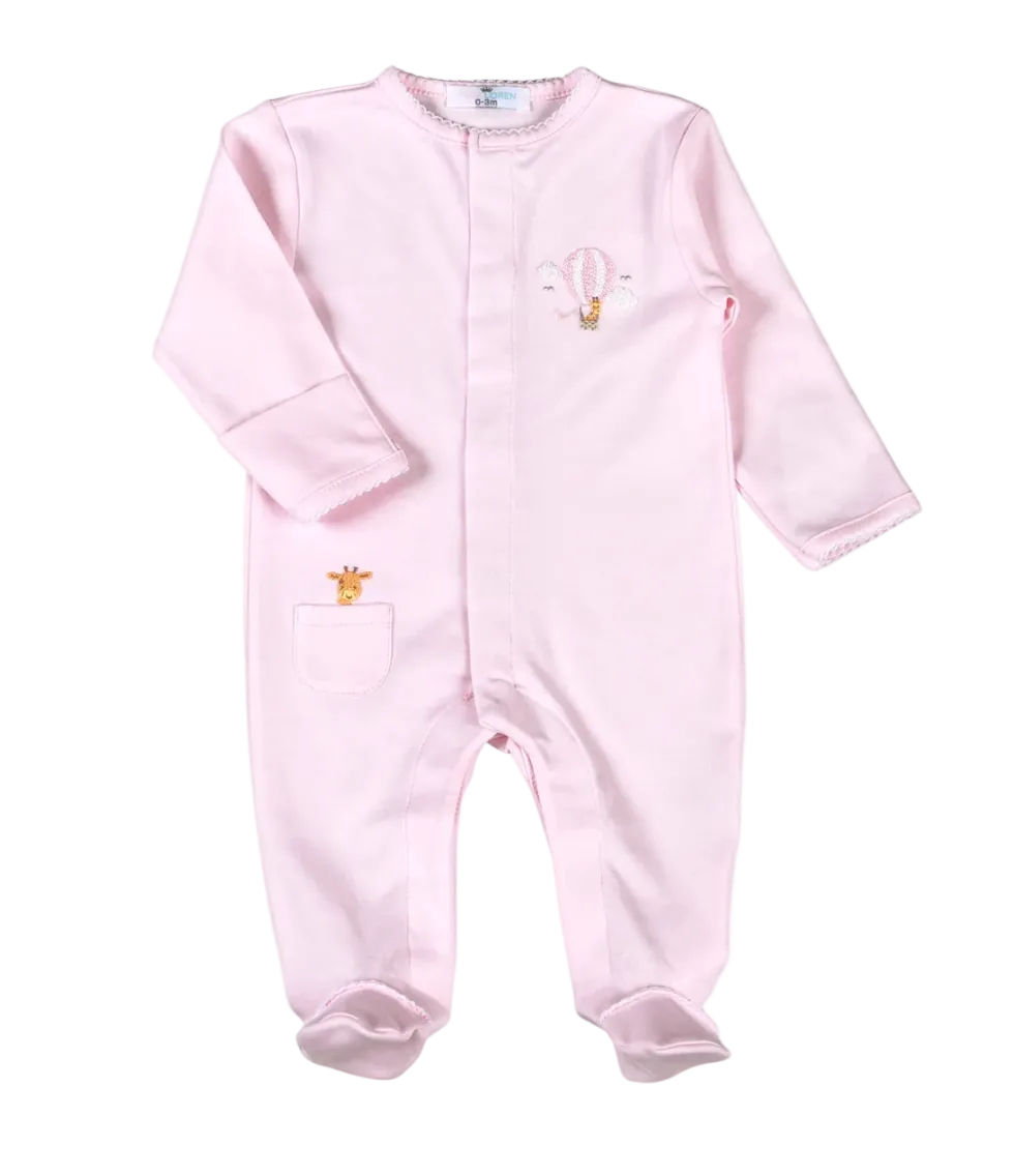 A light pink long-sleeve baby footed romper with a small embroidered hot air balloon and giraffe motif on the chest and a matching pocket on the leg, shown against a plain white background.