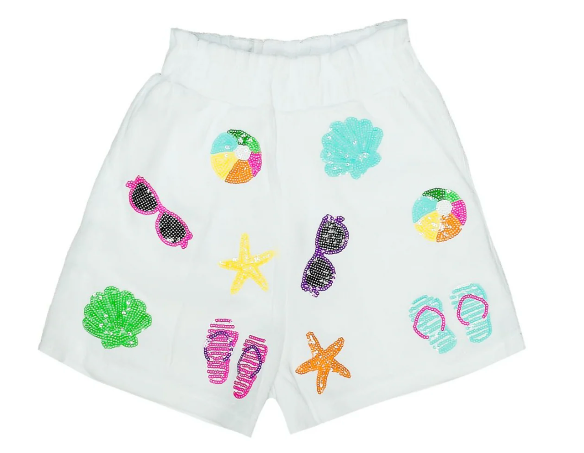 White sequin shorts with colorful sunglasses, flip-flops, beach balls, seashells, and starfish designs—perfect for spring break or pairing with your Belle Cher Beach Terry Cloth Bottom.