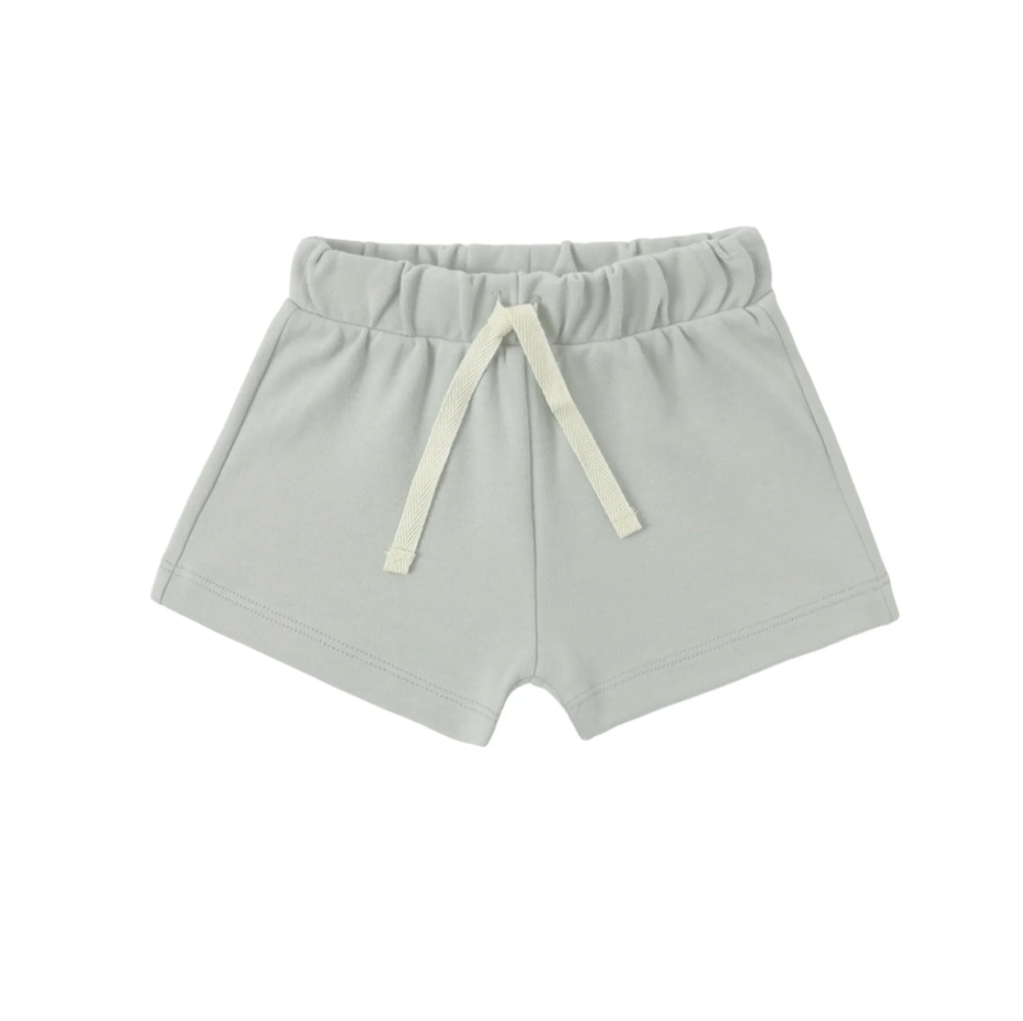 Light sage shorts with a drawstring on a white background