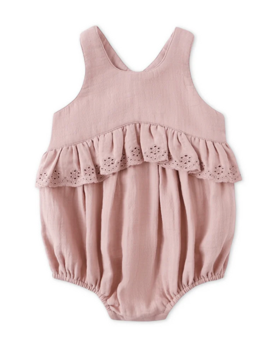 Pink baby romper with ruffled details on a white background