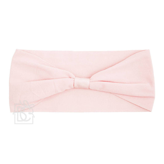 The Beyond Creations, LLC WIDE PANTYHOSE ADD-A-BOW HEADBAND in light pink features a large central bow. Laid flat on a white background, this stylish accessory is versatile and perfect for any occasion.