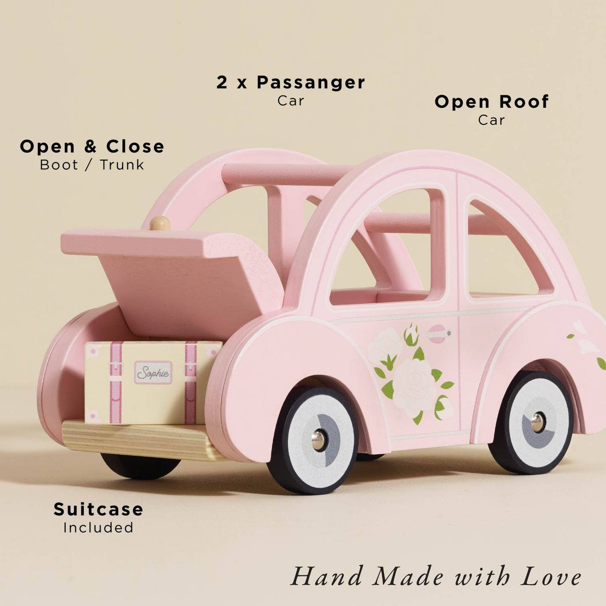 Sophie's Dolls House Toy Car by Le Toy Van, Inc. is a hand-made, plastic-free pink retro car with floral details. Features include open-close trunk with suitcase inside, open roof, fits two passengers. Carefully crafted with love.